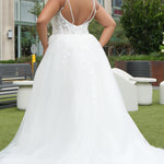 Michelle Bridal MB2620 shown in Ivory. 

Bridal ballgown with many layers of soft tulle and crinoline and satin lining. V-neckline, beaded straps, sheer bodice with floral appliques. Natural waistline and optional bodice lining. Long train and center back zipper. 