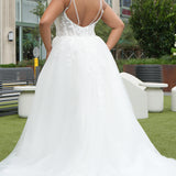 Michelle Bridal MB2620 shown in Ivory. 

Bridal ballgown with many layers of soft tulle and crinoline and satin lining. V-neckline, beaded straps, sheer bodice with floral appliques. Natural waistline and optional bodice lining. Long train and center back zipper. 