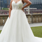 Michelle Bridal MB2620 shown in Ivory. 

Bridal ballgown with many layers of soft tulle and crinoline and satin lining. V-neckline, beaded straps, sheer bodice with floral appliques. Natural waistline and optional bodice lining. Long train and center back zipper. 