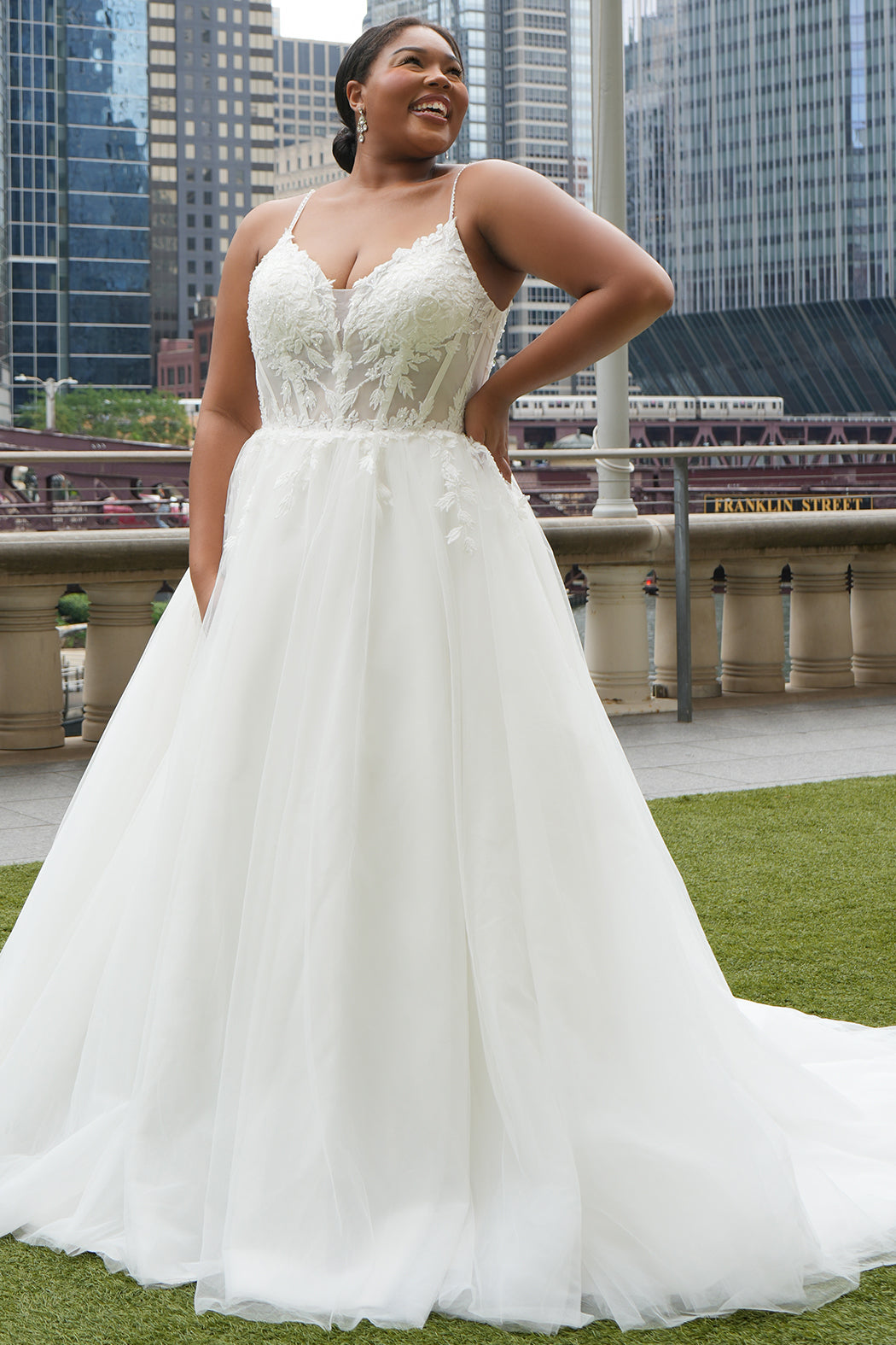 Michelle Bridal MB2620 shown in Ivory. 

Bridal ballgown with many layers of soft tulle and crinoline and satin lining. V-neckline, beaded straps, sheer bodice with floral appliques. Natural waistline and optional bodice lining. Long train and center back zipper. 