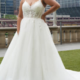 Michelle Bridal MB2620 shown in Ivory. 

Bridal ballgown with many layers of soft tulle and crinoline and satin lining. V-neckline, beaded straps, sheer bodice with floral appliques. Natural waistline and optional bodice lining. Long train and center back zipper. 