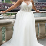 Michelle Bridal MB2620 shown in Ivory. 

Bridal ballgown with many layers of soft tulle and crinoline and satin lining. V-neckline, beaded straps, sheer bodice with floral appliques. Natural waistline and optional bodice lining. Long train and center back zipper. 