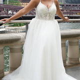 Michelle Bridal MB2620 shown in Ivory. 

Bridal ballgown with many layers of soft tulle and crinoline and satin lining. V-neckline, beaded straps, sheer bodice with floral appliques. Natural waistline and optional bodice lining. Long train and center back zipper. 