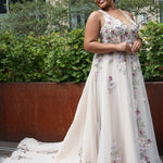 Michelle Bridal MB2622 shown in Floral Champagne. 

Ballgown with thick bra-friendly straps. V-neck, natural waistline, ballgown skirt,  multicolored floral appliques, soft tulle and satin lining. Long train and center back zipper with covered buttons. 