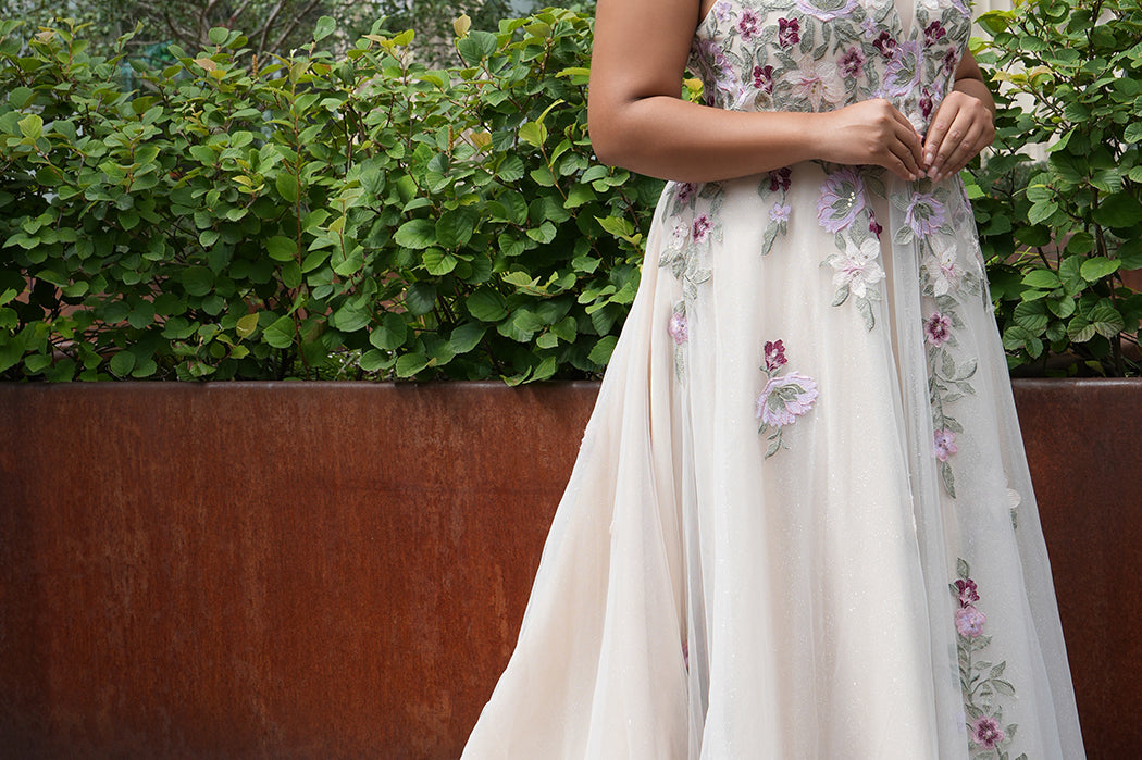 Michelle Bridal MB2622 shown in Floral Champagne. 

Ballgown with thick bra-friendly straps. V-neck, natural waistline, ballgown skirt,  multicolored floral appliques, soft tulle and satin lining. Long train and center back zipper with covered buttons. 
