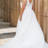 Michelle Bridal MB2622 shown in Ivory. 

Ballgown with thick bra-friendly straps. V-neck, natural waistline, ballgown skirt,  floral appliques, soft tulle and satin lining. Long train and center back zipper with covered buttons. 