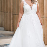 Michelle Bridal MB2622 shown in Ivory. 

Ballgown with thick bra-friendly straps. floral appliques, soft tulle and satin lining. Long train and center back zipper with covered buttons. 
