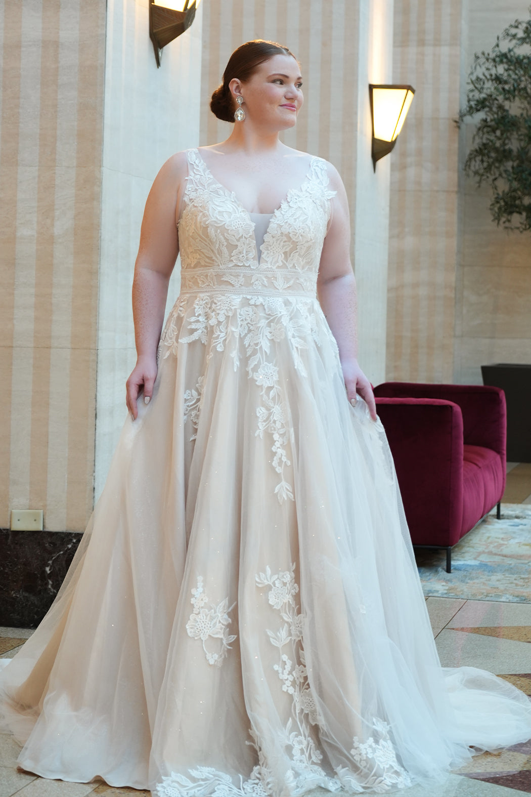 Michelle Bridal MB2624 shown in Ivory/Champagne. 

Bra-friendly straps, v-neckline, A-line skirt. Soft bridal tulle, lace appliques and satin lining. 3 inch waistband, natural waistline, v-back, long train and center back zipper. 