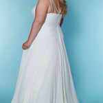 Sydney's Closet Bridal SC5305 Ivory. Stretch sequin shell with satin, A-line silhouette, V-neckline, Surplice bodice, Straps: = ½ inch spaghetti straps, Center back drop measures 11 inches from nap of neck to top of zipper, Pockets in side seams of A-line skirt, Slit starts at 17 inches down from natural waistline, Finished hemline with 2-inch horsehair border, Train measures 60 inches from back center of waist to hemline