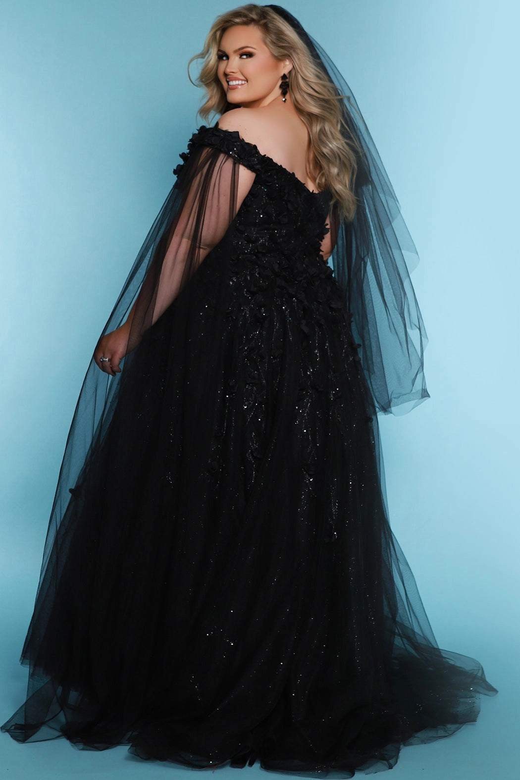 Sydney's Closet SC5315 Black. Detachable tulle scarves, Detachable spaghetti straps, Ball gown silhouette, Off-the-shoulder strap with elastic band, Detachable tulle scarves, Sweetheart neckline, Full ball gown skirt, Long invisible center back zipper, Chiffon 3D flowers on glitter net over sparkle tulle.