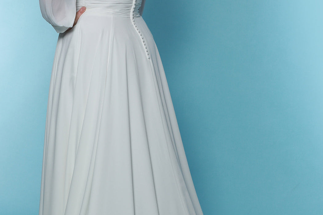 Sydney's Closet SC5320 ivory. Bridal chiffon, Satin lining, Silhouette: A-line, Neckline: V-neckline, Lightly pleated bodice, Bra-friendly straps, Long sleeves with cuff, Fully lined, Natural waistline, V-back, Long invisible center back zipper.