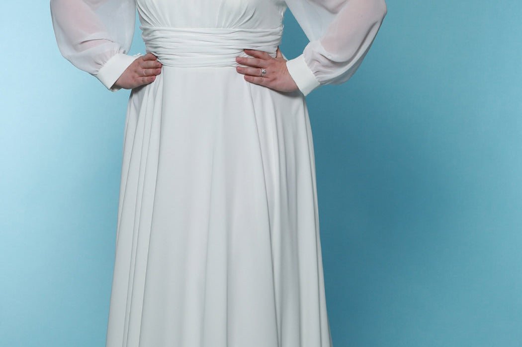 Sydney's Closet SC5320 ivory. Bridal chiffon, Satin lining, Silhouette: A-line, Neckline: V-neckline, Lightly pleated bodice, Bra-friendly straps, Long sleeves with cuff, Fully lined, Natural waistline, V-back, Long invisible center back zipper.