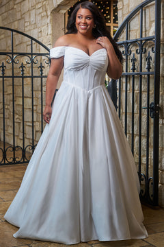 Plus size classic and simple wedding dress. Style SC5347 by Sydney's Closet.  Strapless sweetheart neckline with pleated bust and pleated off-the-shoulder sleeves. Exposed corset boning on a basque waist with full A-line skirt, box pleats, pockets and a long train. Available in black or ivory in curvy sizes 14-32.