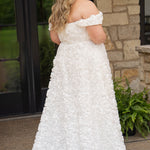 Plus size formal event dress or unique edgy wedding dress. 3D floral fabric. Scoop neckline with cat-eye detail, detachable drape sleeves, A-line skirt with pockets and train.  Sydney's Closet style SC7397 for formal gown or SC5354 for bridal gown is available in black or ivory. 