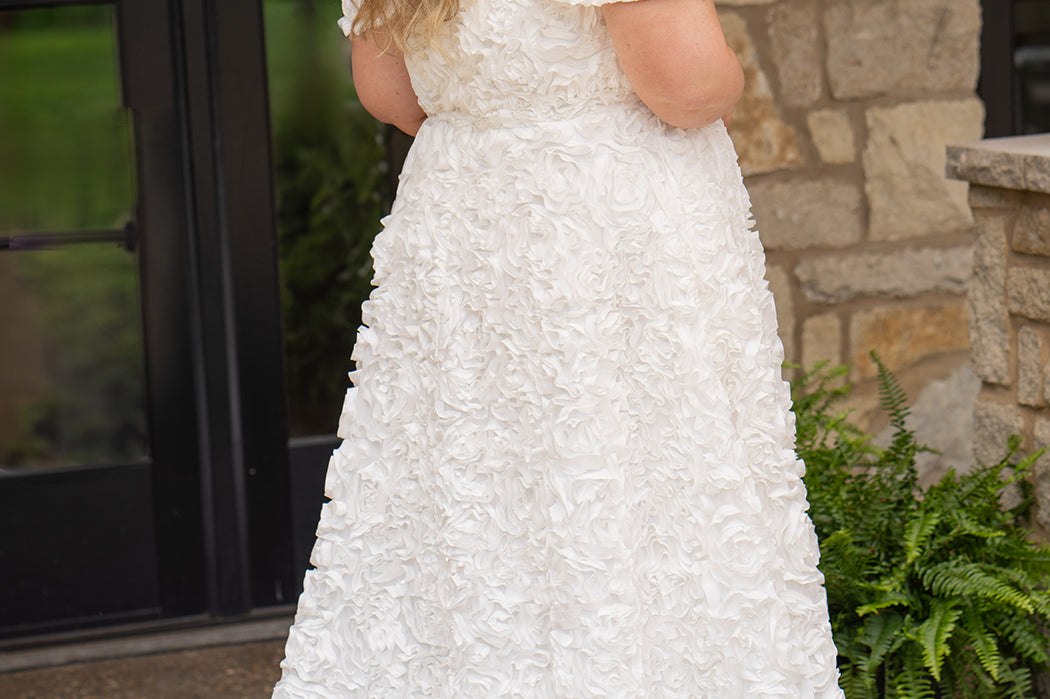 Plus size formal event dress or unique edgy wedding dress. 3D floral fabric. Scoop neckline with cat-eye detail, detachable drape sleeves, A-line skirt with pockets and train.  Sydney's Closet style SC7397 for formal gown or SC5354 for bridal gown is available in black or ivory. 