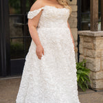 Plus size formal event dress or unique edgy wedding dress. 3D floral fabric. Scoop neckline with cat-eye detail, detachable drape sleeves, A-line skirt with pockets and train.  Sydney's Closet style SC7397 for formal gown or SC5354 for bridal gown is available in black or ivory. 