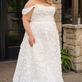 Plus size formal event dress or unique edgy wedding dress. 3D floral fabric. Scoop neckline with cat-eye detail, detachable drape sleeves, A-line skirt with pockets and train.  Sydney's Closet style SC7397 for formal gown or SC5354 for bridal gown is available in black or ivory. 