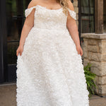 Plus size formal event dress or unique edgy wedding dress. 3D floral fabric. Scoop neckline with cat-eye detail, detachable drape sleeves, A-line skirt with pockets and train.  Sydney's Closet style SC7397 for formal gown or SC5354 for bridal gown is available in black or ivory. 