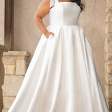 Sydney's Closet style SC5365 - Ivory bridal Mikado satin wedding dress with square neckline, wide straps with detachable bows, natural waistline, full A-line skirt with box pleats, pockets and a long train. 