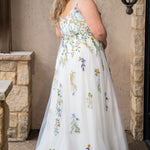 Sydney's Closet SC5371 plus size wedding dress.  Multi-colored floral lace on ivory tulle. Sexy plunging V-neckline with exposed corset boning.  Basque waistline on A-line skirt with slit and long train with lace details. Perfect for the unique, trendy bride.