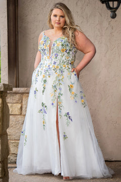Sydney's Closet SC5371 plus size wedding dress.  Multi-colored floral lace on ivory tulle. Sexy plunging V-neckline with exposed corset boning.  Basque waistline on A-line skirt with slit and long train with lace details. Perfect for the unique, trendy bride.