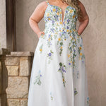 Sydney's Closet SC5371 plus size wedding dress.  Multi-colored floral lace on ivory tulle. Sexy plunging V-neckline with exposed corset boning.  Basque waistline on A-line skirt with slit and long train with lace details. Perfect for the unique, trendy bride.