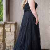 Sydney's Closet SC5372 plus size wedding dress.  Black floral lace on black tulle. Sexy plunging V-neckline with exposed corset boning.  Basque waistline on A-line skirt with slit and long train with lace details. Perfect for the unique, alternative bride. 