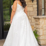 Sydney's Closet SC5372 plus size wedding dress.  Ivory floral lace on ivory tulle. Sexy plunging V-neckline with exposed corset boning.  Basque waistline on A-line skirt with slit and long train with lace details. 