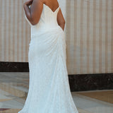 Sydney's Closet style SC5374 in ivory.

Strapless stretch lace, cat eye bodice, exposed boning,  asymmetrical waist, zipper back, ruched lace skirt and horse hair hem. 
