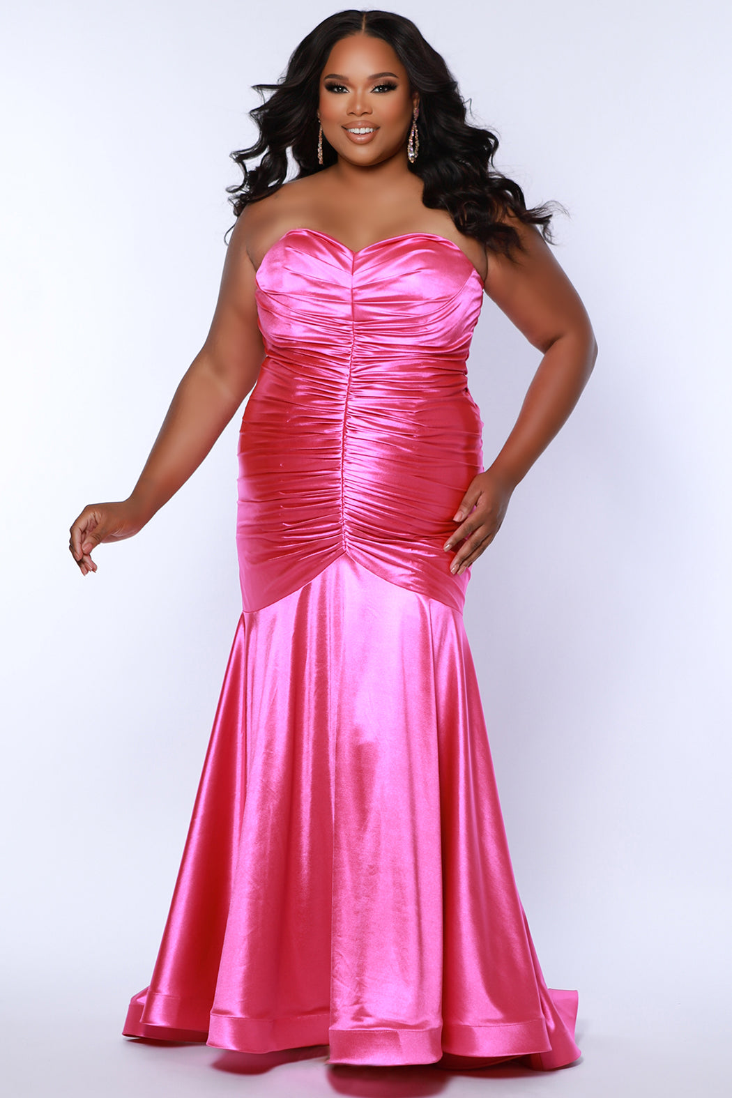 Sydney's Closet SC7364 Pink. Stretch Satin, Stretch knit lining, Fitted silhouette, Strapless Sweetheart bodice, optional spaghetti straps, Ruched front and back bodice, Invisible center back zipper, Sweep train, Horsehair hem