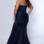 Sydney's Closet SC7374 Navy. Stretch jersey, Stretch knit lining, Fitted silhouette, Strapless, Sweetheart bodice, Optional spaghetti straps, Ruched front and back bodice, Invisible center back zipper, Sweep train, Horsehair hem