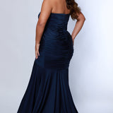 Sydney's Closet SC7374 Navy. Stretch jersey, Stretch knit lining, Fitted silhouette, Strapless, Sweetheart bodice, Optional spaghetti straps, Ruched front and back bodice, Invisible center back zipper, Sweep train, Horsehair hem