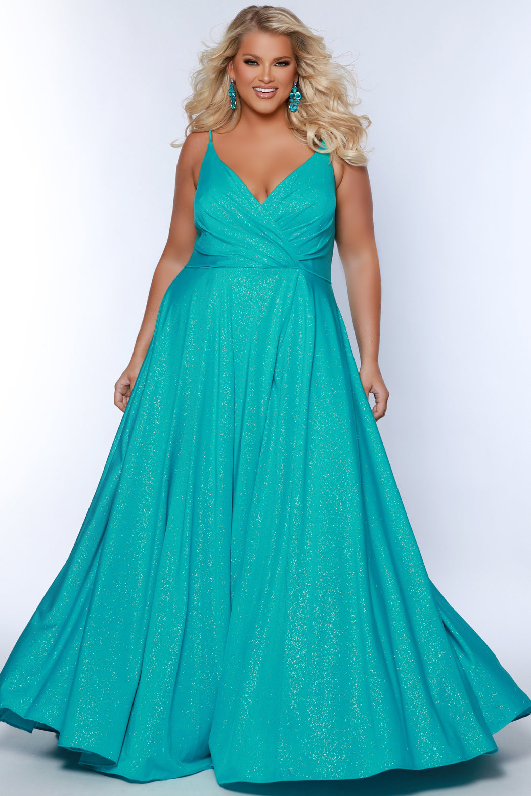 Sydney's Closet SC7375 Aqua. Aline silhouette, Stretch jersey with sparkle over stretch knit lining, V-neckline, Spaghetti straps, Natural waistline, Aline skirt with pockets.