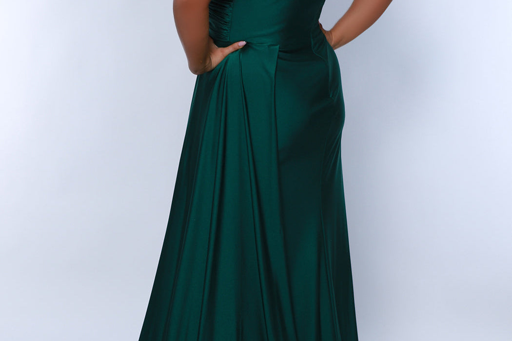Sydney's Closet SC7377 Green. Stretch jersey over stretch knit lining, One-shoulder neckline, Ruched bodice, Natural waistline, Slim A-line skirt with train, Side fly away panel at waist, Long invisible center back zipper, Horsehair hem, Sweep train