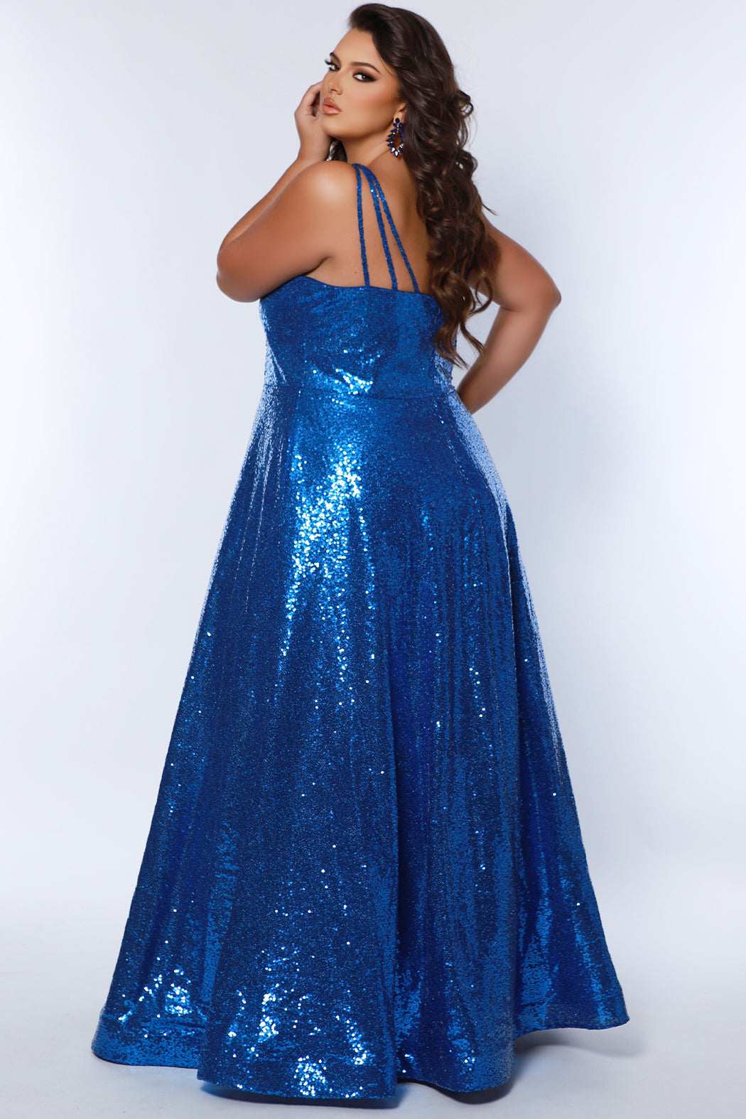 Sydney's Closet SC7387 Royal. All over dense sequin, scoop neckline, sequin covered straps, floor length A-line skirt, horse hair hem, center back zipper.