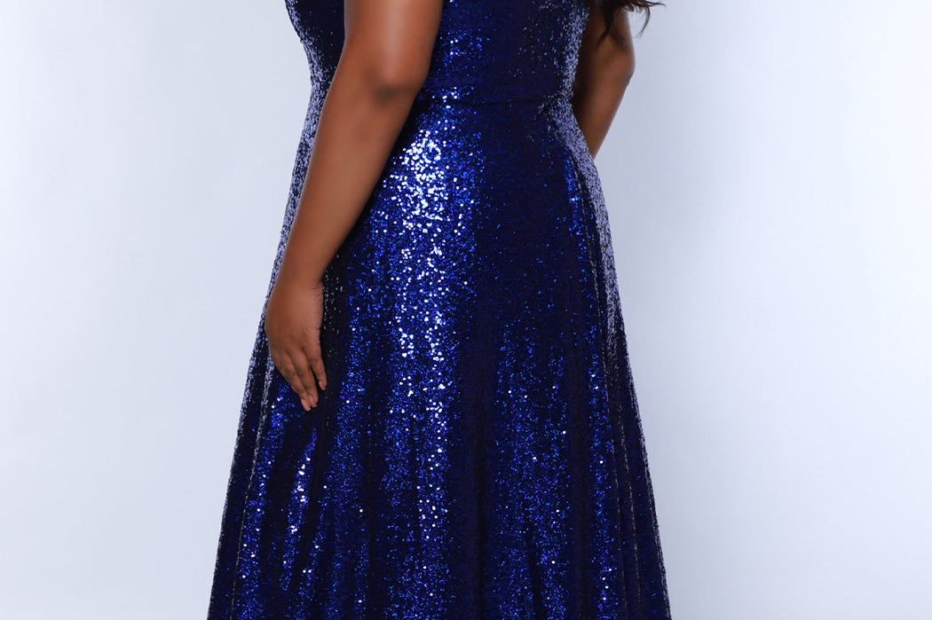 Sydney's Closet SC7389 Sapphire. Dense sequin,  A-line skirt, sweetheart neckline with sequin covered straps that cross the front of the chest, natural waistline, center back zipper, floor length.