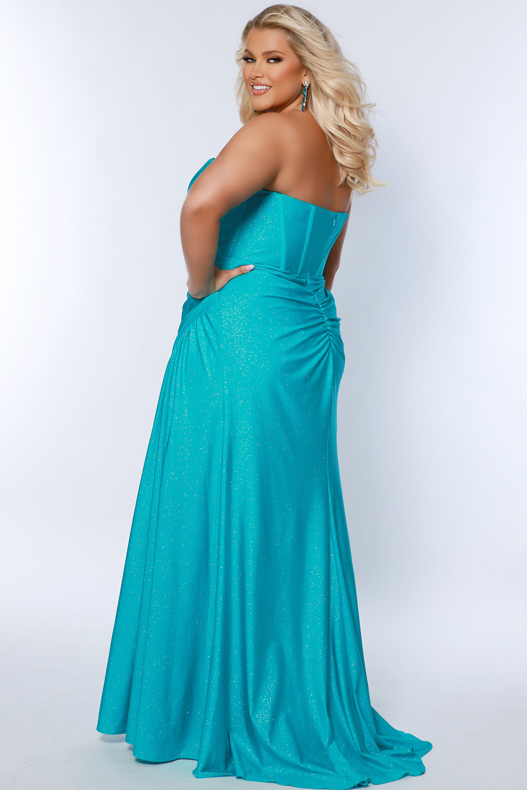 Sydney's Closet SC7390 Aqua. Strapless sweetheart bodice with exposed boning, sparkle stretch lycra, slit, side ruching, floor length , modified Basque waist.