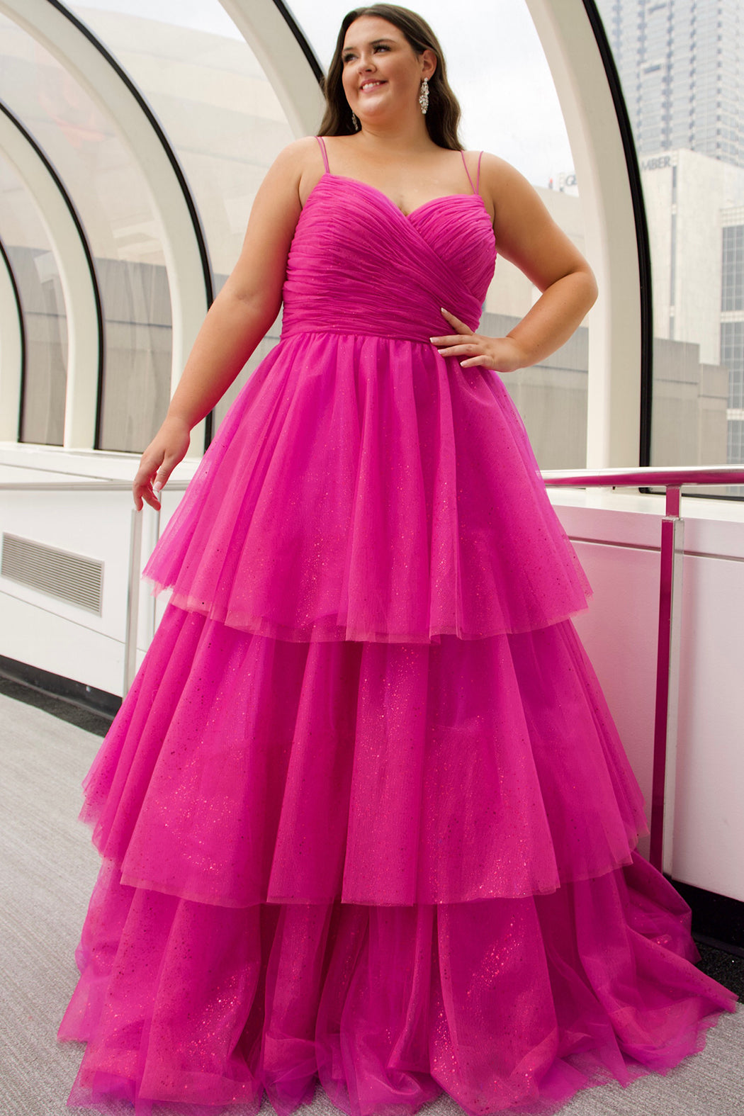Sydney's Closet SC7392 Pink. Tiered glitter tulle ballgown, pleated bodice, rolled satin straps covered in glitter tulle, natural waistline, center back zipper.