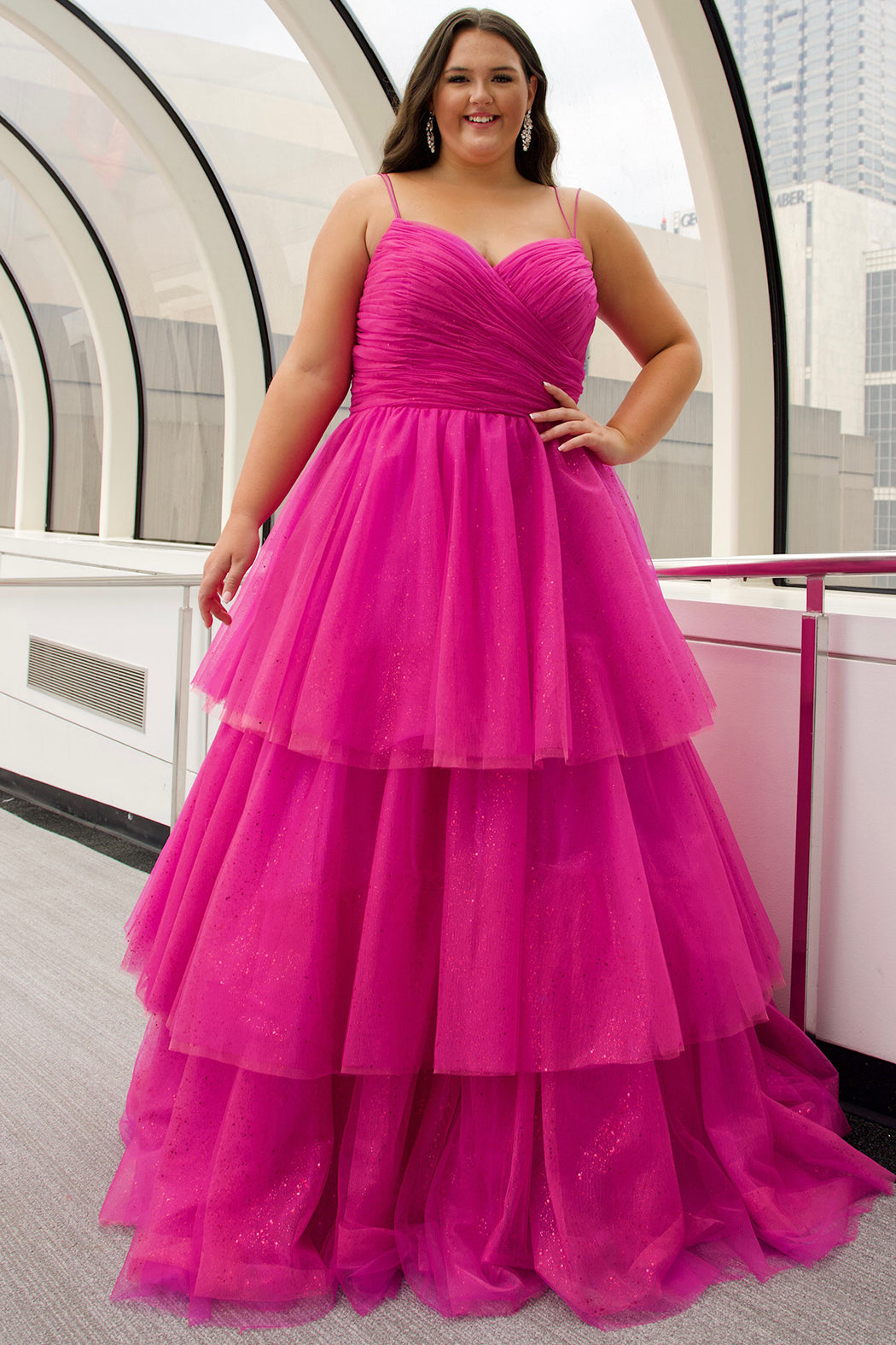Sydney's Closet SC7392 Pink. Tiered glitter tulle ballgown, pleated bodice, rolled satin straps covered in glitter tulle, natural waistline, center back zipper.