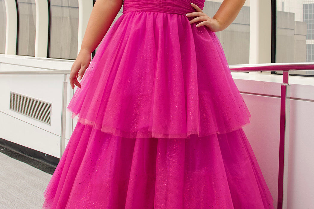 Sydney's Closet SC7392 Pink. Tiered glitter tulle ballgown, pleated bodice, rolled satin straps covered in glitter tulle, natural waistline, center back zipper.