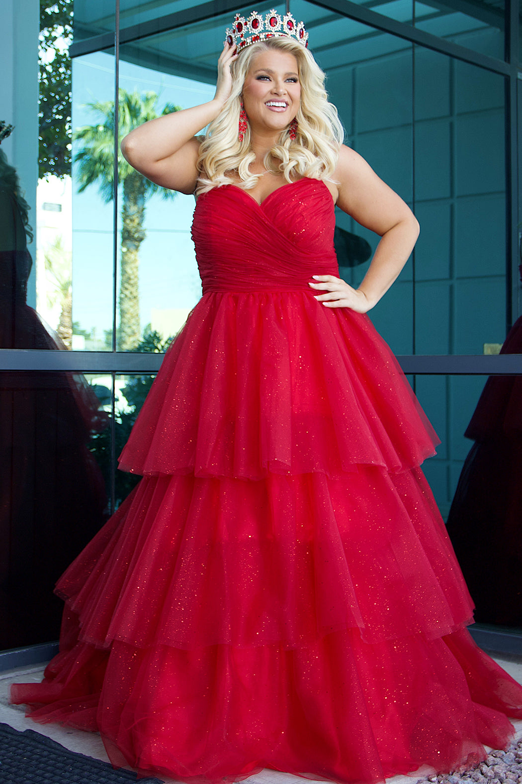 Sydney's Closet SC7392 Red. Tiered glitter tulle ballgown, pleated bodice, rolled satin straps covered in glitter tulle, natural waistline, center back zipper.