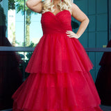 Sydney's Closet SC7392 Red. Tiered glitter tulle ballgown, pleated bodice, rolled satin straps covered in glitter tulle, natural waistline, center back zipper.