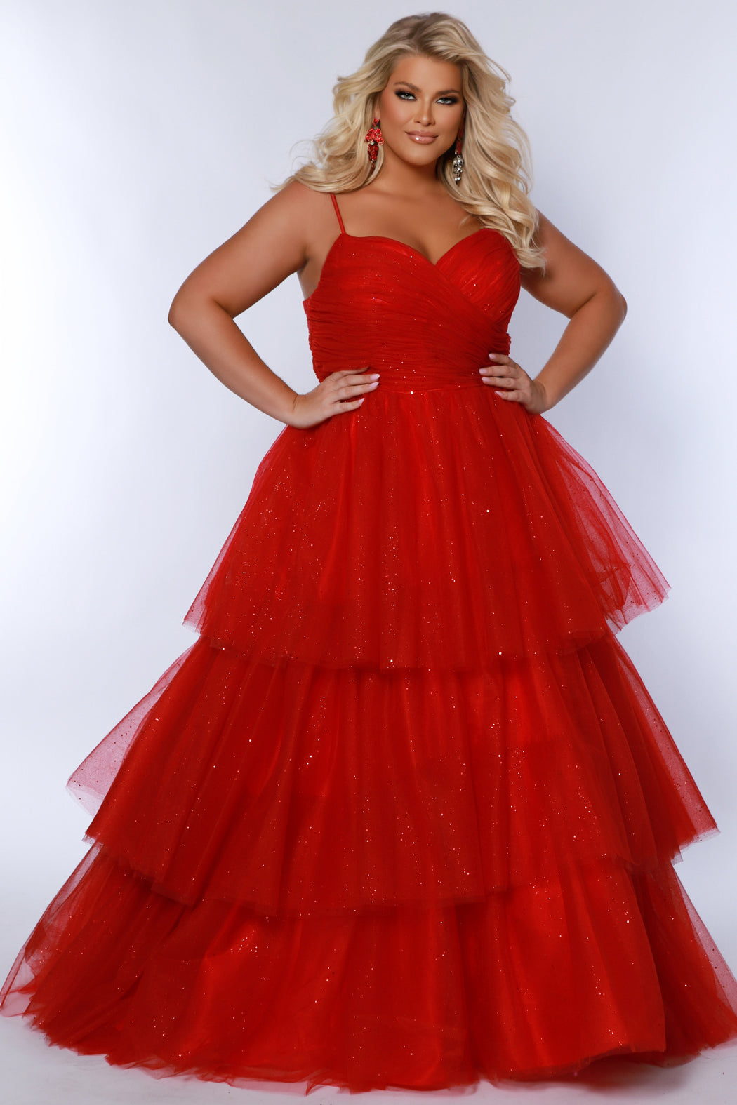 Sydney's Closet SC7392 Red. Tiered glitter tulle ballgown, pleated bodice, rolled satin straps covered in glitter tulle, natural waistline, center back zipper. 