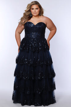 Strapless, sweetheart plus size gala formal ballgown. Exposed corset boning on bodice covered in lace applqiues. Tiered A-line skirt with matching lace applique hem. Style SC7398 is available in forest green, navy blue or burgundy red by Sydney's Closet. 