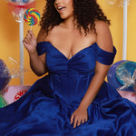 Long formal satin ballgown style SC7400 by Sydney's Closet. Available in sizes 14-32 in colors cobalt blue, onyx black and ruby red.  Pleated bodice with exposed boning, detachable pleated drape sleeves, basque waist and pockets.  