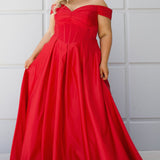 Long formal satin ballgown style SC7400 by Sydney's Closet. Available in sizes 14-32 in colors cobalt blue, onyx black and ruby red.  Pleated bodice with exposed boning, detachable pleated drape sleeves, basque waist and pockets.  