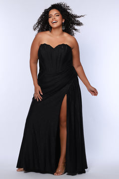 Sparkle stretch lycra plus size formal dress.  Strapless sweetheart neckline, basque waistline, exposed corset boning on bodice, ruchsed fitted skirt with high slit and zipper back. Available in sapphire blue, emerald green and onyx black. SC7412 by Sydney's Closet