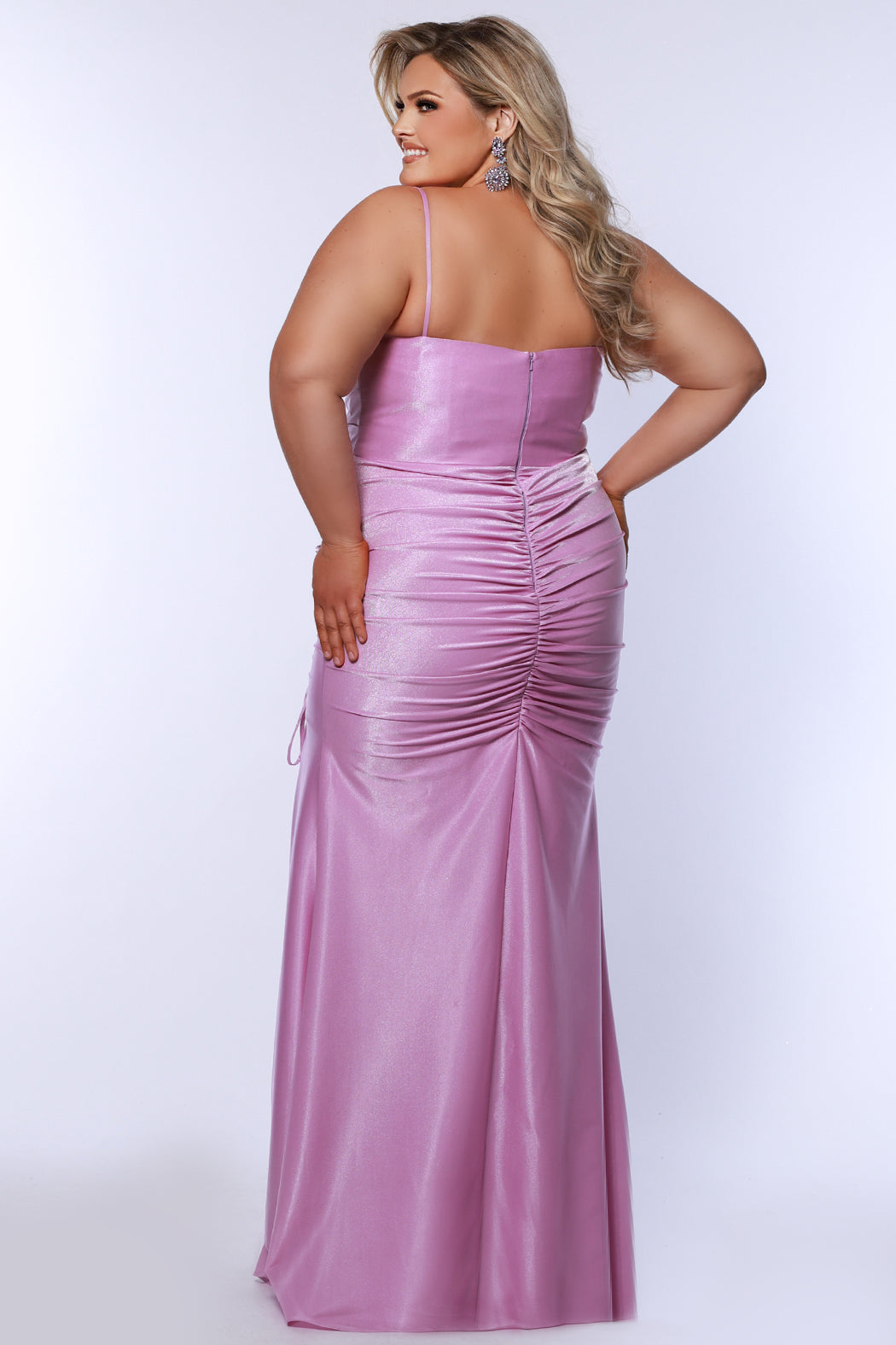 Slim fitted stretch satin plus size formal prom dress.  Pleated bodice, ruched skirt with gathered ties on slit, spaghetti straps and ruched back skirt with train.  Availablie in light blue, orange and lilac in sizes 14-24. Style SC7422 by Sydney's Closet. 