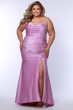 Slim fitted stretch satin plus size formal prom dress.  Pleated bodice, ruched skirt with gathered ties on slit, spaghetti straps and ruched back skirt with train.  Availablie in light blue, orange and lilac in sizes 14-24. Style SC7422 by Sydney's Closet. 