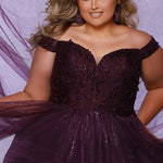 Plus size elegeant off-the-shoulder ball gown with 3D floral lace and sparkle tulle. Full A-line skirt and center back zipper. Availablie in burgundy red, onyx black and plum purple in plus sizes 14-40. Style SC7428 from Sydney's Closet.